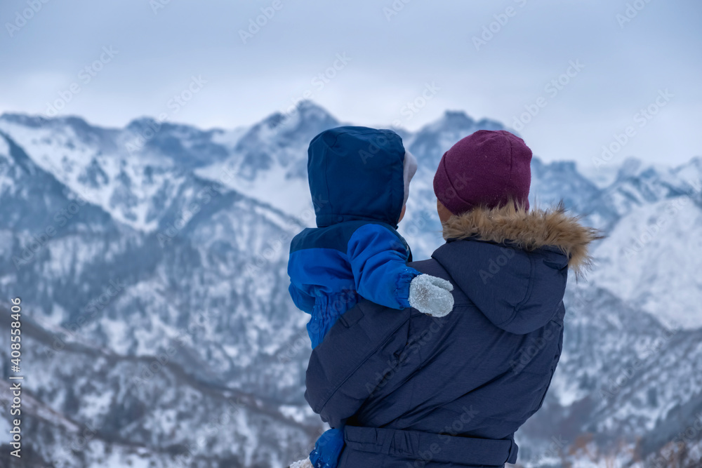Mother with child in mountains admiring for beautiful view. Mother with child in mountains admiring for beautiful view.
