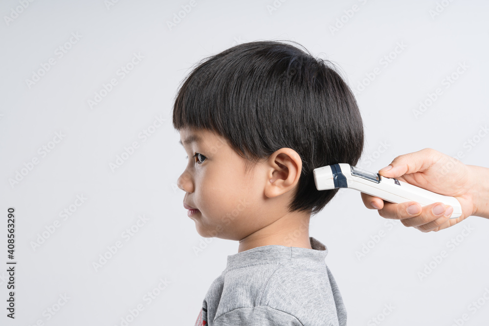 Asian boy being test by medical thermometer for body temperature Asian boy being test by medical thermometer for body temperature