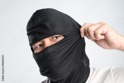 Asian man wearing elastic full face black hood mask