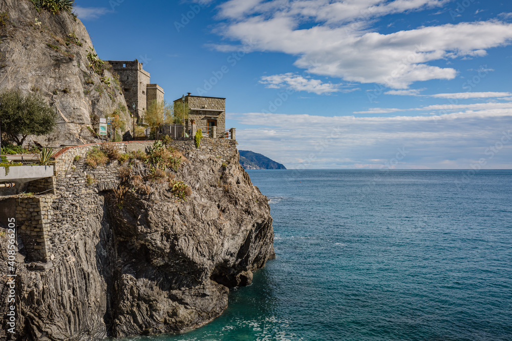 Monterosso al Mare, a coastal village and resort in Cinque Terre, Italy. Way to the small touristic town: stone stairs on the rock wall, tunnel through the mountain and defensive naval bunker