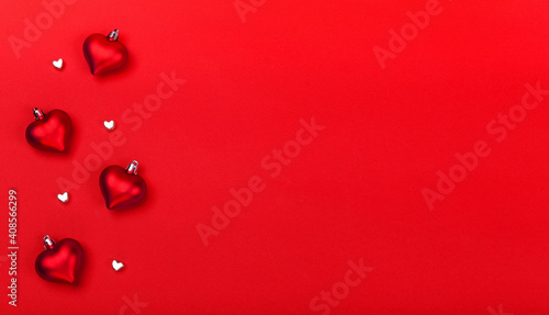 Valentines Day greeting card with red hearts on red background.