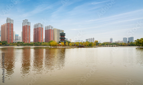 In autumn, ancient buildings and arch bridges are in Yingze Park, Taiyuan, Shanxi Province, China photo