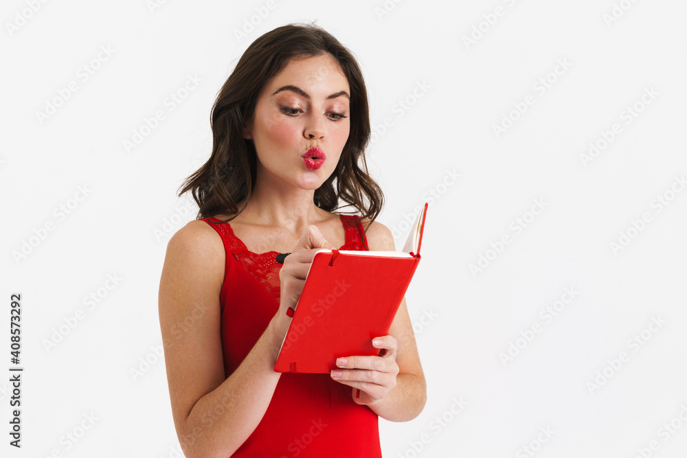 Thinking beautiful girl writing down notes in planner Thinking beautiful girl writing down notes in planner