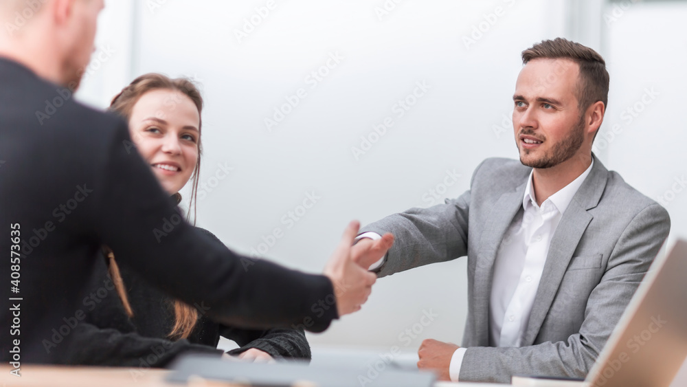 business people greeting each other with a handshake. business people greeting each other with a handshake.