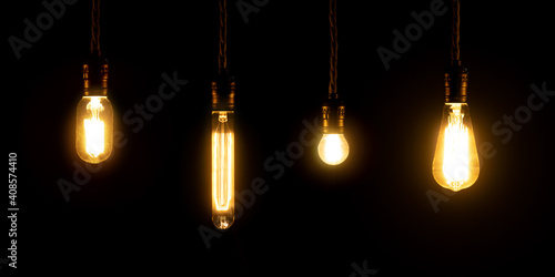 Set of vintage glowing light bulbs on black background. Retro luxury interior bulb. Electricity concept.