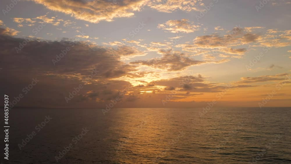 Aerial view of Sunset over the sea in the tropics, top view. Sunrise over ocean. Philippines. Seascape, morning over the islands. Aerial view of Sunset over the sea in the tropics, top view. Sunrise over ocean. Philippines. Seascape, morning over the islands.