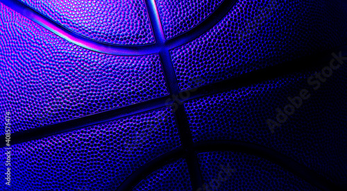 Closeup detail of basketball ball texture background. Blue neon and hologram banner Art. Team sport concept © Augustas Cetkauskas