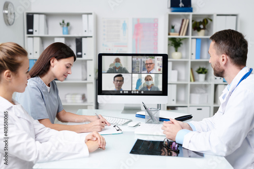 Group of practitioners consulting with colleagues during online communication