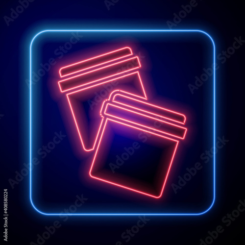 Glowing neon Plastic bag with ziplock icon isolated on blue background. Vector.