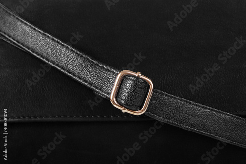 Part of black leather product close up