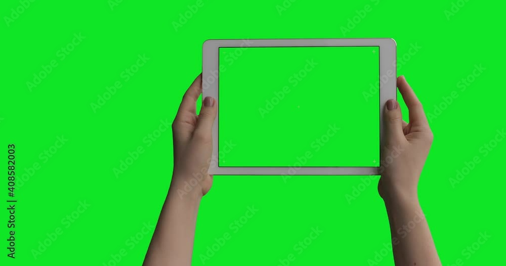 iPad Air Tablet In Female Hands isolated on green screen background with alpha channel luma matte. Pre Keyed for easy screen replacement. Mock-up for your content. iPad Air Tablet In Female Hands isolated on green screen background with alpha channel luma matte. Pre Keyed for easy screen replacement. Mock-up for your content.