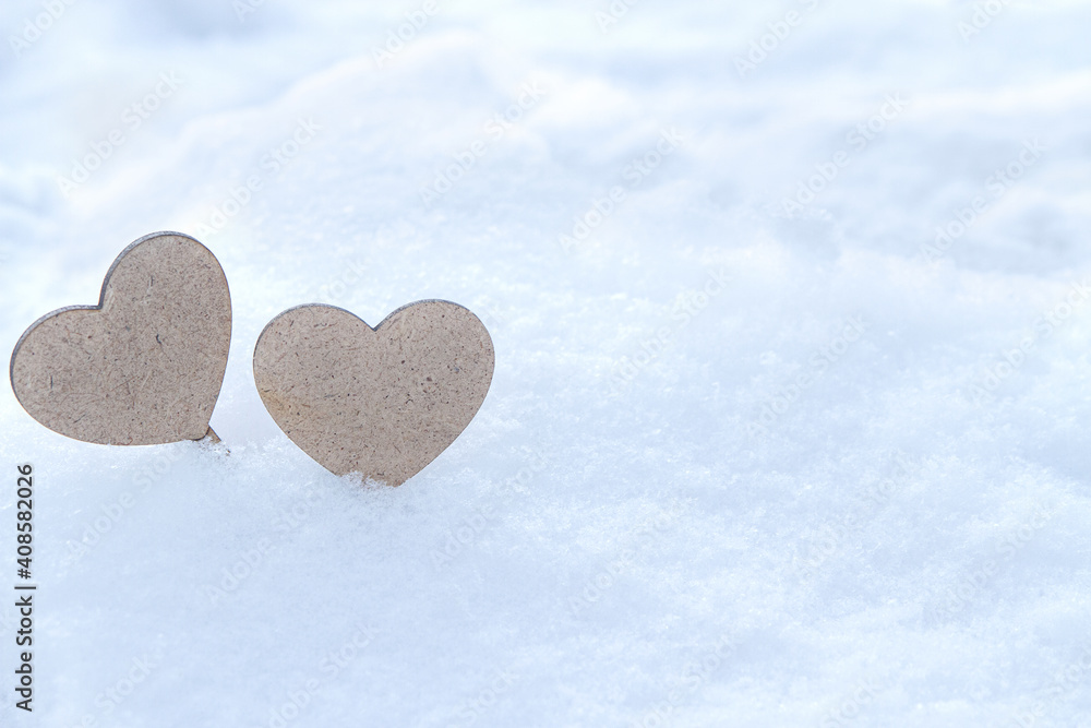 Obraz premium Couple hearts on snow background. St. Valentine's Day background.