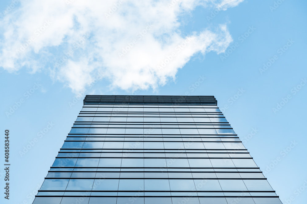 Fototapeta premium underside panoramic and perspective view to steel blue glass high rise building skyscrapers, business concept of successful industrial architecture