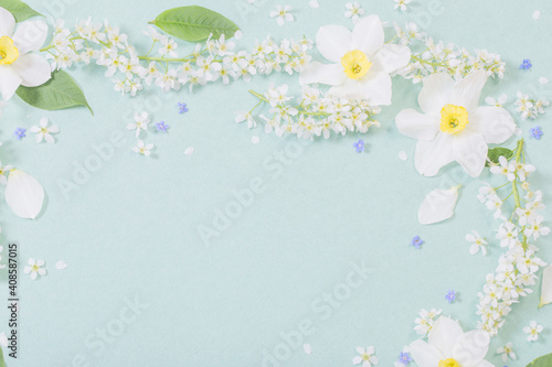 white spring flowers on paper background