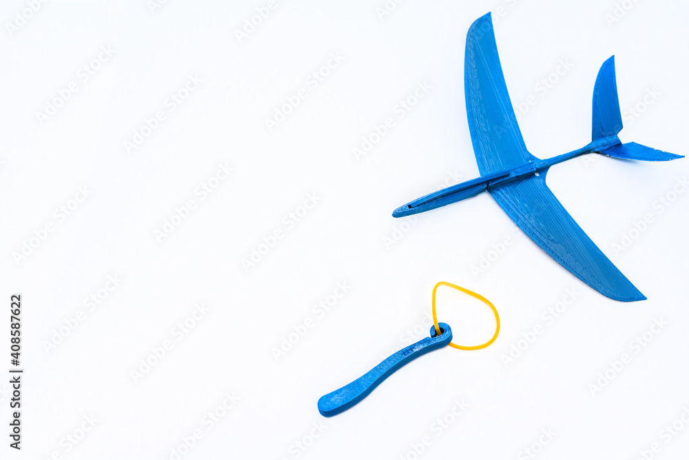 toy plane launched with rubber band, white background toy plane launched with rubber band, white background