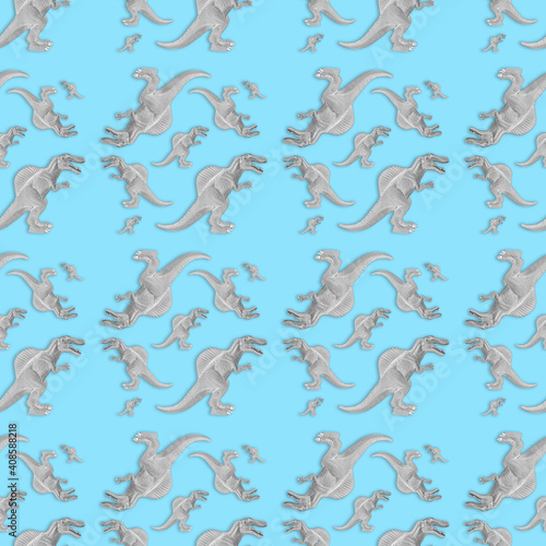 Creative seamless dinosaur pattern on blue background. Abstract art.