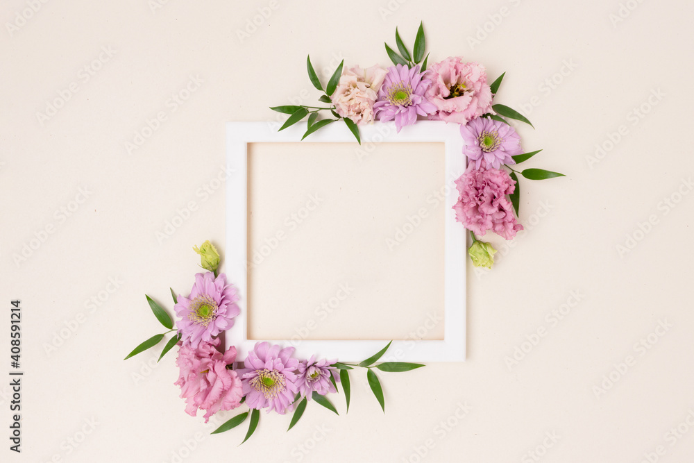 Square flower frame made of pink eustoma on a beige background. Greeting card template with copyspace. Romantic concept.