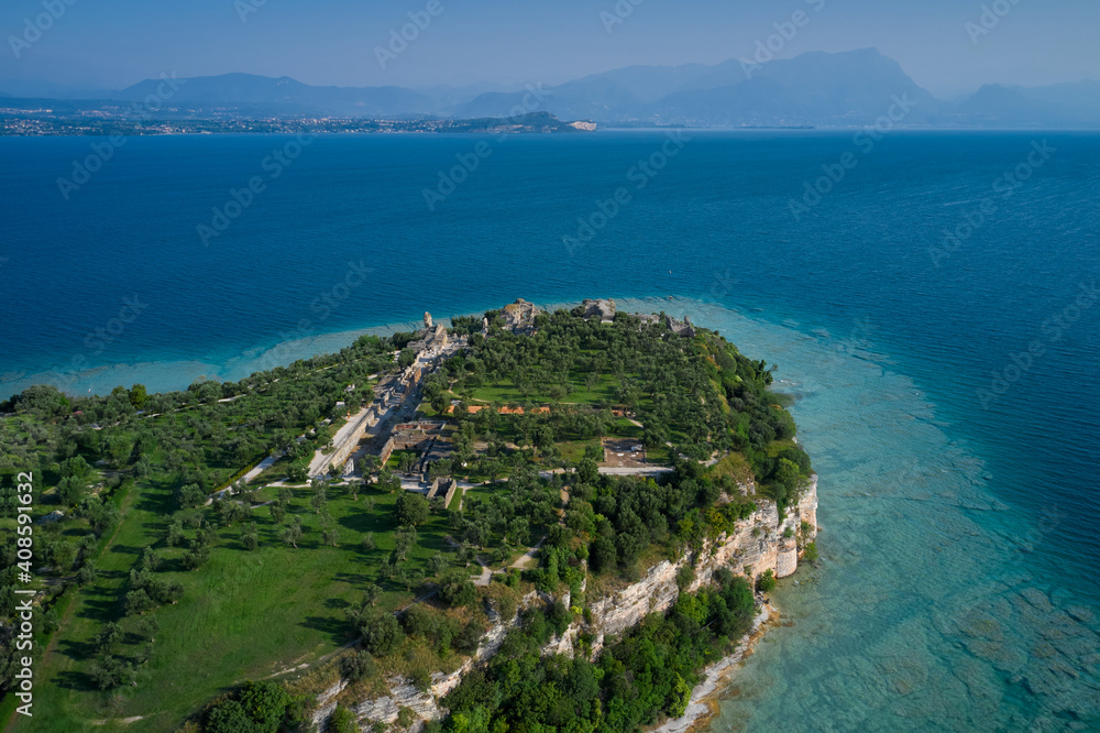 Archaeological site of Grotte di Catullo, Sirmione, Italy early morning aerial view. lake garda. Grottoes of Catullus is the name given to the ruins of a Roman villa