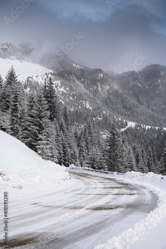Amazing mountain road covered with snow in a winter morning, great landscape