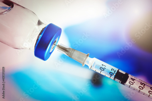 medical syringe with vaccine vial. vaccination concept. closeup