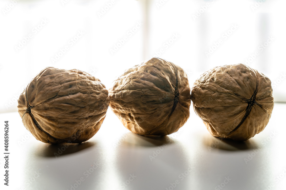 Walnuts stand on a white background composed of different variations ...