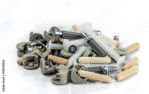 A bunch of fittings from various materials for assembling furniture. Isolated on white background.