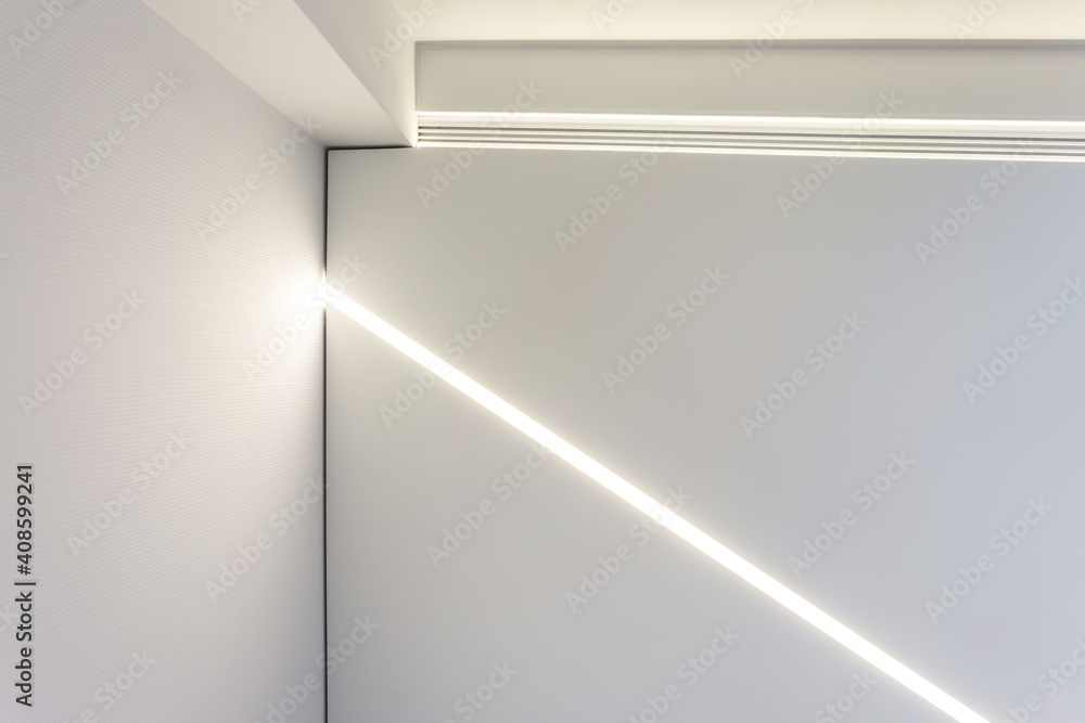 suspended ceiling with halogen spots lamps and drywall construction in empty room in apartment or house. Stretch ceiling white and complex shape. suspended ceiling with halogen spots lamps and drywall construction in empty room in apartment or house. Stretch ceiling white and complex shape.