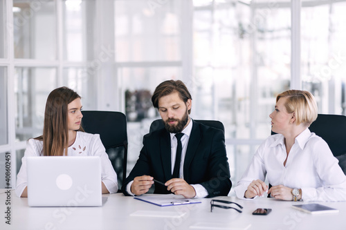 Wallpaper Mural Group of dedicated business people dressed in suits having meeting at boardroom. Torontodigital.ca