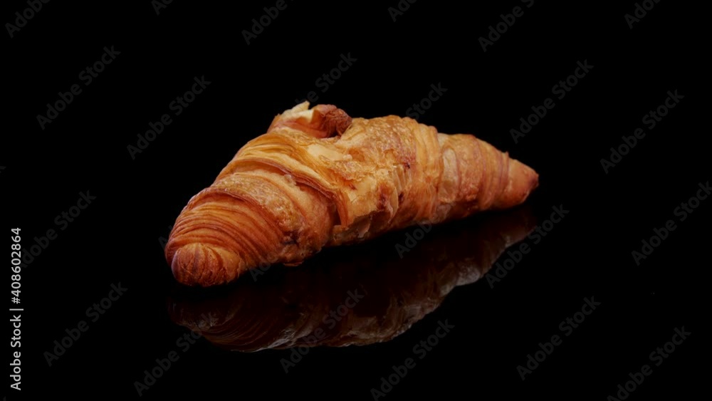 Fresh baked croissant. French croissant rotating on a black background. Fresh and tasty french breakfast.
Fresh baked croissant. French croissant rotating on a black background. Fresh and tasty french breakfast.