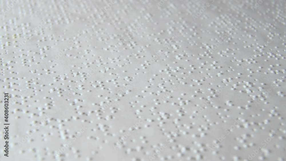 Braille Alphabet Printed Paper Slowly Rotating close up. Visually impaired book. Aid for the blind. Braille Alphabet Printed Paper Slowly Rotating close up. Visually impaired book. Aid for the blind.