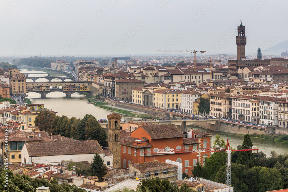 Aerial view of Florence, Italy. Ponte Vecchio (Old Bridge) over the Arno River and the Palazzo Vecchio, town hall.