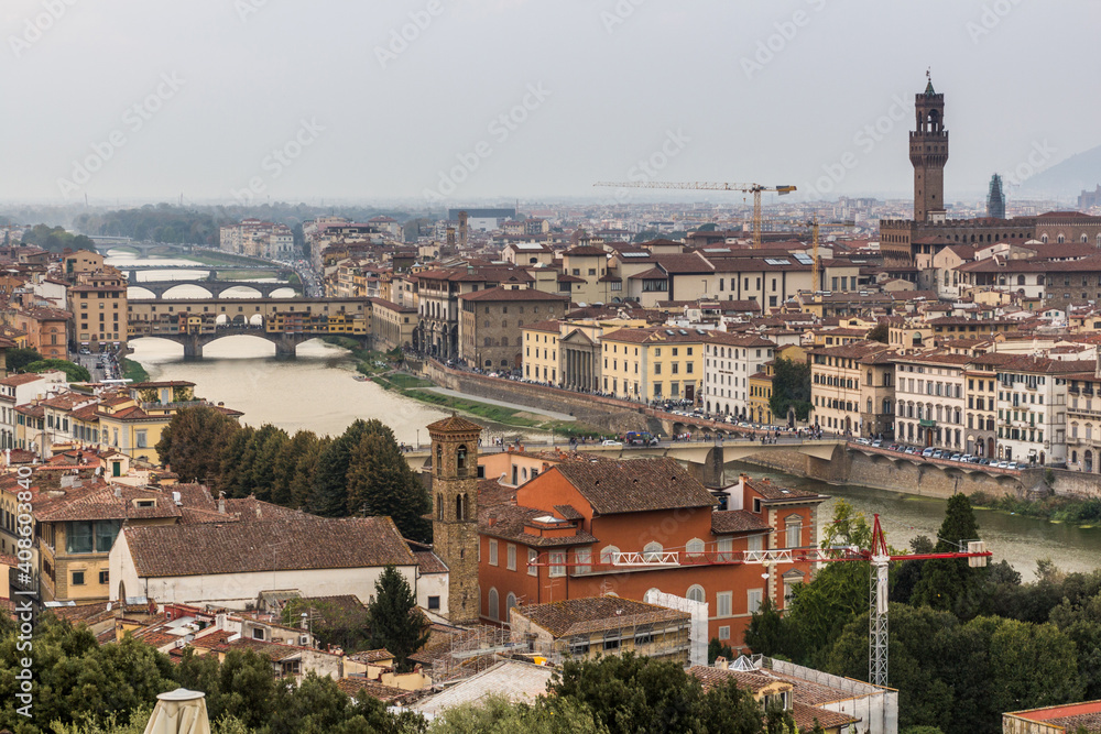 Aerial view of Florence, Italy. Ponte Vecchio (Old Bridge) over the Arno River and the Palazzo Vecchio, town hall.