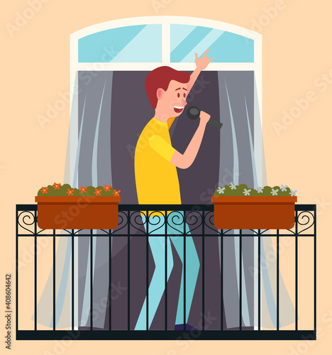 A guy with a microphone sings and dances on the balcony of his house. Male character is resting at home. Citizen stays at home, hobby time relaxing. Man performing music standing on the veranda
