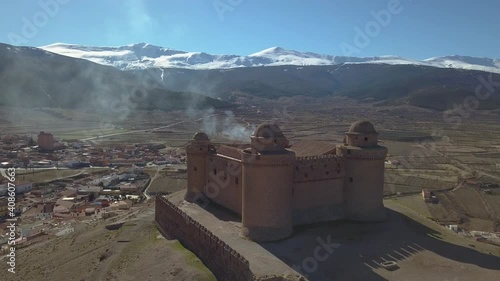 Aerial view of the castle of La Calahorra with Sierra Nevada behind in Granada, Spain. photo