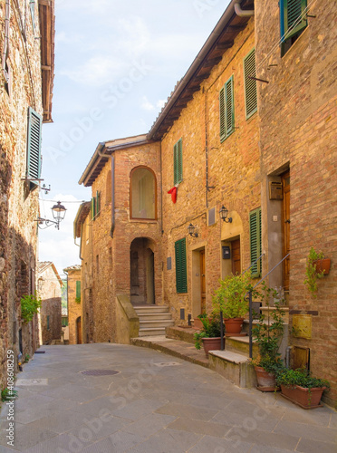 Fototapeta Naklejka Na Ścianę i Meble -  A quiet residential street in the historic centre of the medieval town of Monticiano in Siena Province, Tuscany, Italy
