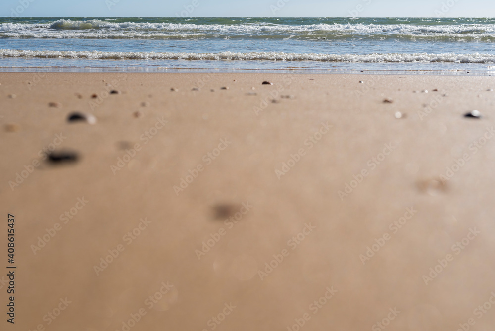 beach sand and waves with copy space and selective focus beach sand and waves with copy space and selective focus