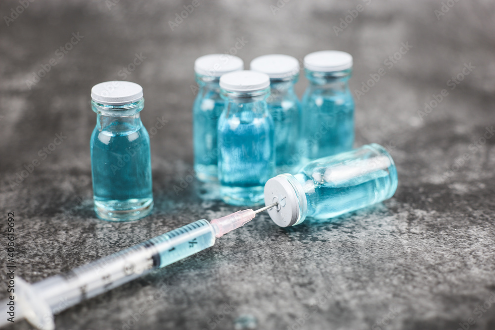 Close up vaccine vial dose flu shot drug needle syringe, medical concept vaccination hypodermic injection treatment, disease care hospital prevention, immunization illness disease isolated background. Close up vaccine vial dose flu shot drug needle syringe, medical concept vaccination hypodermic injection treatment, disease care hospital prevention, immunization illness disease isolated background.