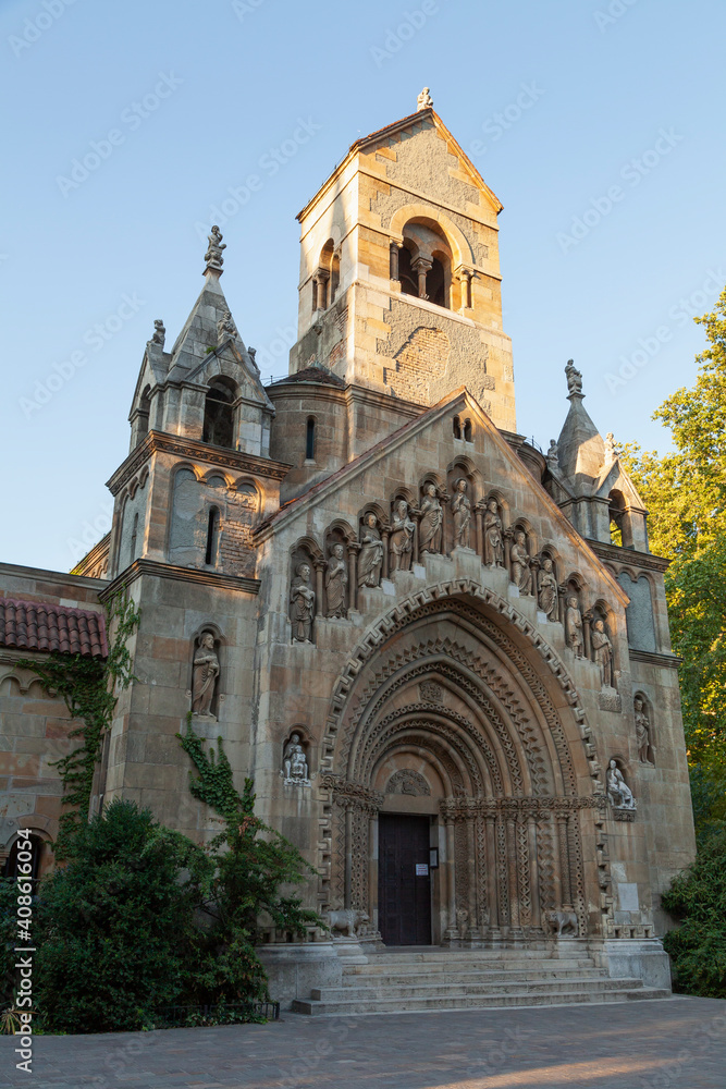 Front view of the Jaki Chapel with its reliefs and statues, in the famous Vajdahunyad Castle, in Budapest, in the City Park at sunset, Budapest.