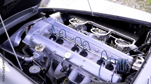 Aston Martin DB5 stright 6 engine filmed on gimbal with cinematic rotaion and slow motion look. photo