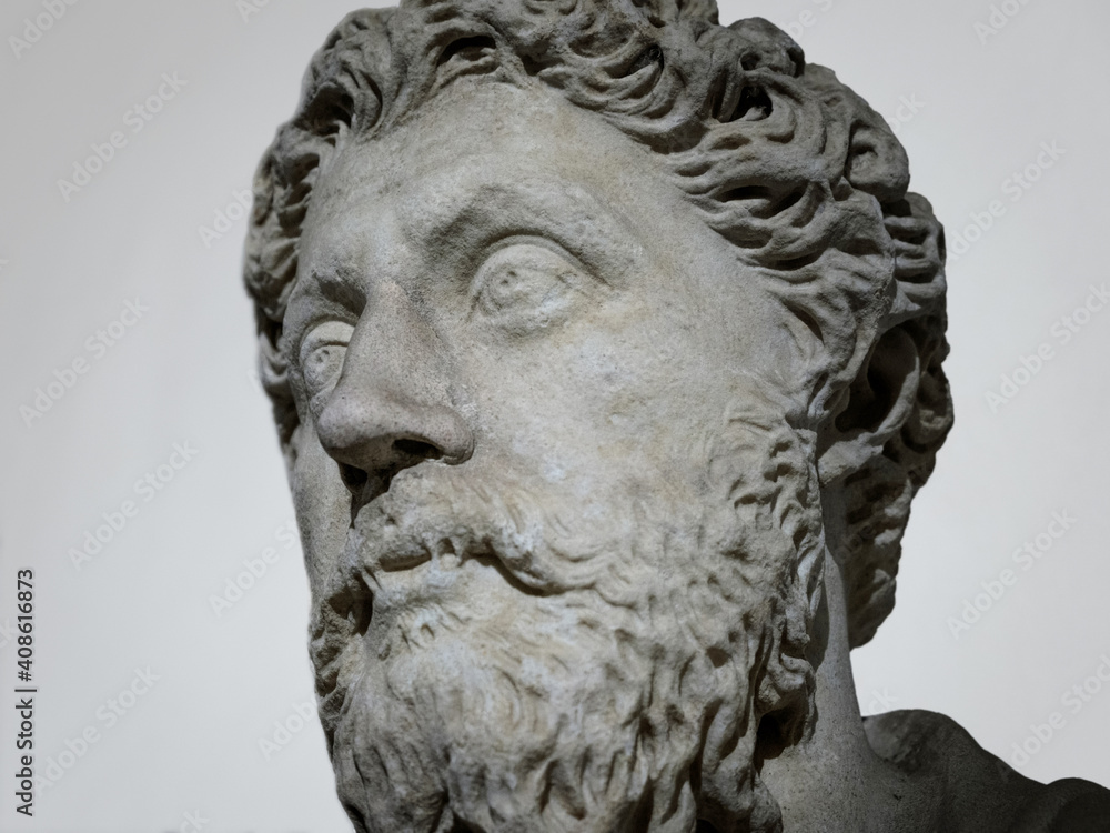Sculpture of Marco Aurelio (Marcus Aurelius) ancient roman emperor marble head background closeup