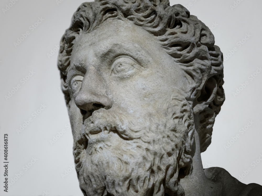 Sculpture of Marco Aurelio (Marcus Aurelius) ancient roman emperor marble head background closeup Sculpture of Marco Aurelio (Marcus Aurelius) ancient roman emperor marble head background closeup