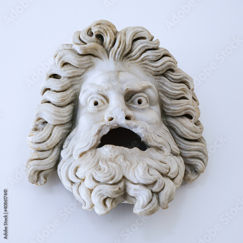Ancient Greek theater tragedy man mask on a white backround