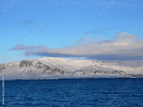 snowy mountains in Iceland ocean