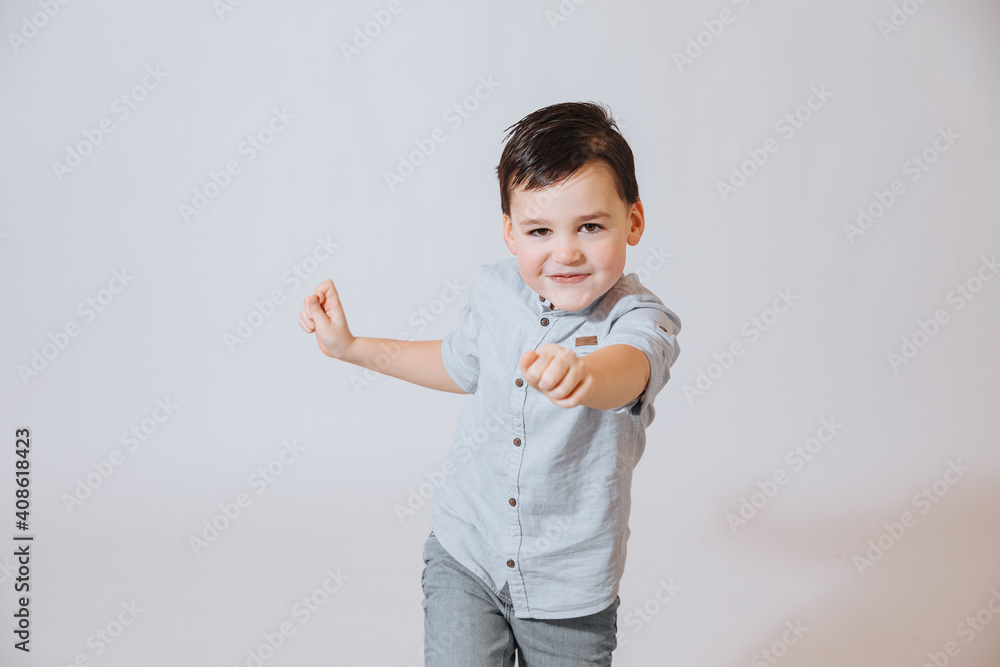 child pointing at you. 5 year old boy is having fun. Boy points forward with his hand. Boy shows emotions child pointing at you. 5 year old boy is having fun. Boy points forward with his hand. Boy shows emotions