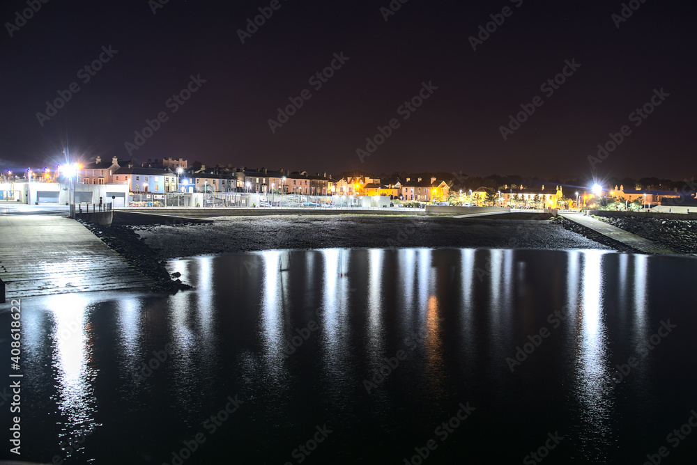 Beautiful night view of Greystones Harbour Marina with light reflection in the water, Greystones, Co. Wicklow, Ireland