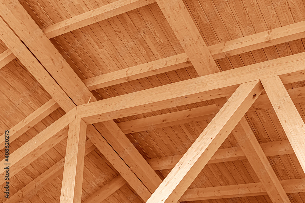 Wooden roof structure. Glued laminated timber roof. Rafters made of wood.
