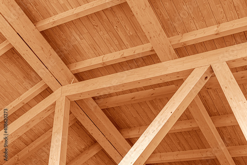 Obraz na płótnie Wooden roof structure. Glued laminated timber roof. Rafters made of wood. w salonie