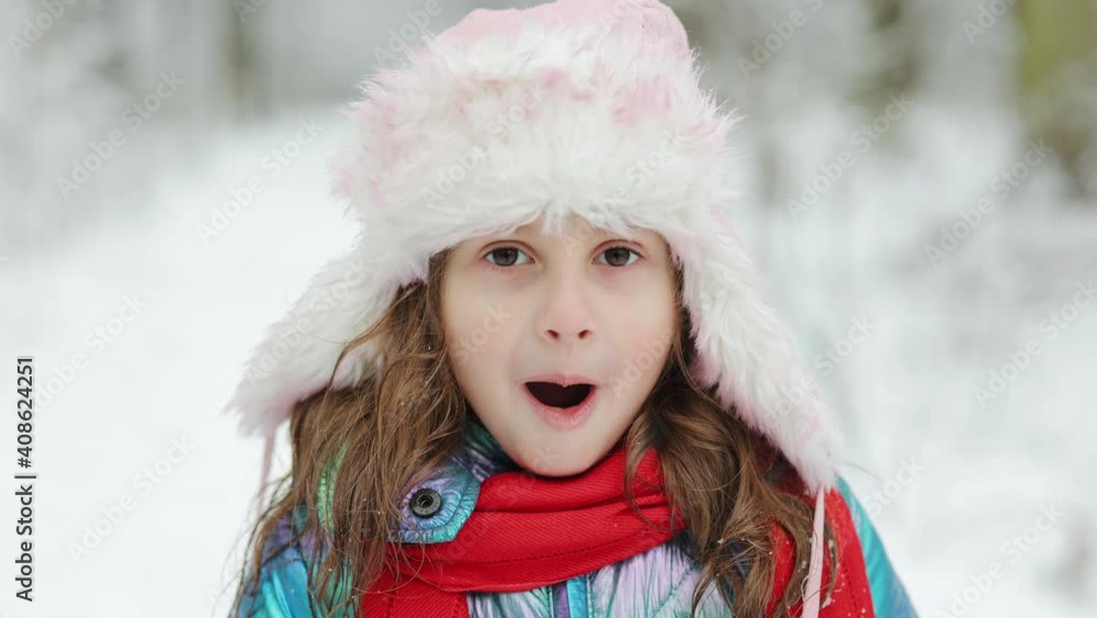 Portrait of joyful Caucasian little cute girl with surprised happy face. Little girl on face surprised child having fun enjoying winter day. Holidays and celebrations concept Portrait of joyful Caucasian little cute girl with surprised happy face. Little girl on face surprised child having fun enjoying winter day. Holidays and celebrations concept