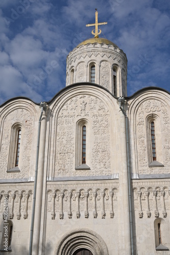 Monumental ancient white orthodox cathedral covered with numerous elaborate carved figures, named after prince Dmitry who built it in XII century in Vladimir city, Russian 
