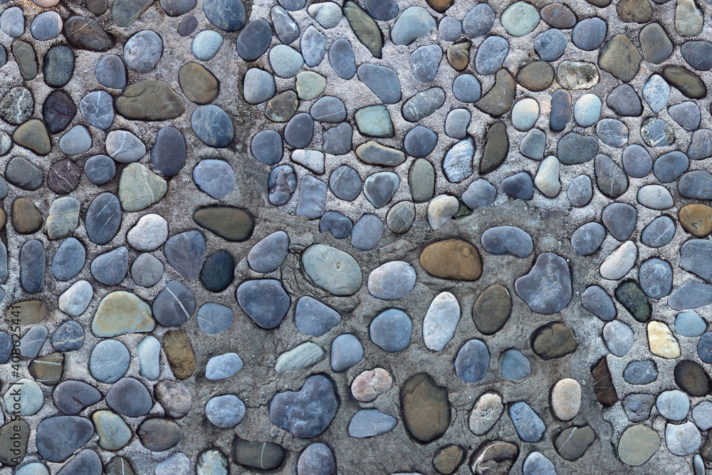 Texture of old pebblestone road. Horizontally seamless background. Montenegro, Prcanj town Texture of old pebblestone road. Horizontally seamless background. Montenegro, Prcanj town